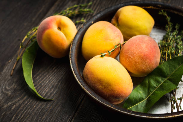 istock Sweet ripe peaches on the rustic background 1174434949