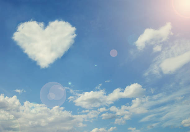 istock Heart shaped cloud in the blue sky 1174435205