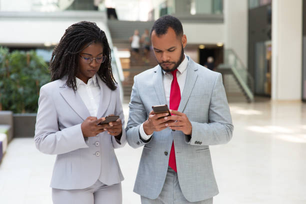 istock Focused diverse business people consulting internet 1174435375