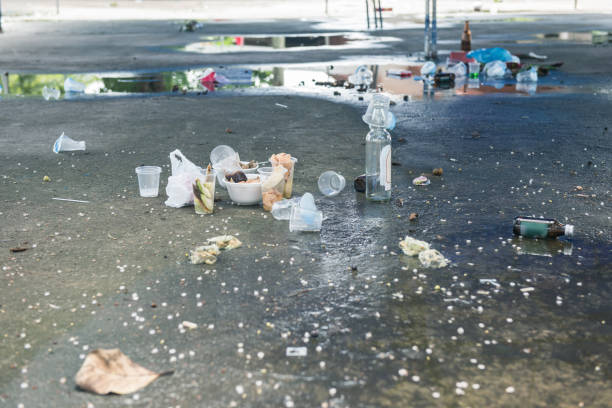 istock dirty garbage on the ground after party event 1174436663