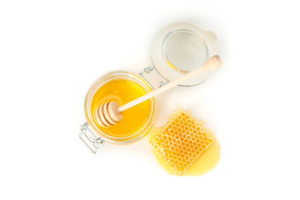 istock Glass jar, honeycomb and dipper isolated on white background 1174436846
