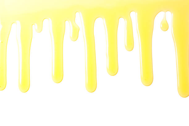 istock Flow of sweet honey isolated on white background 1174437219