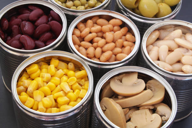 istock Canned food on black table background 1174438521