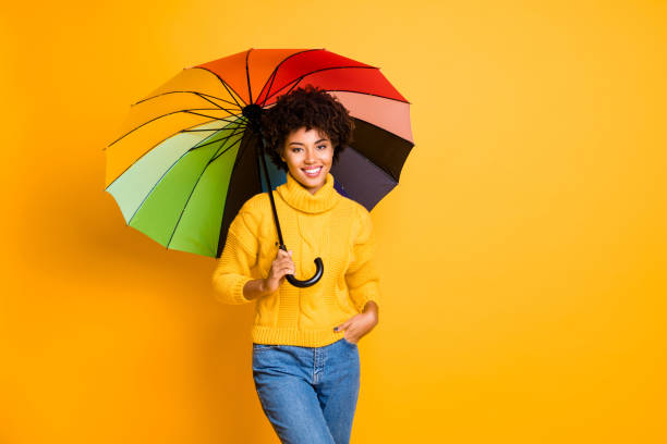 istock Rainy day is not a problem concept. Photo of positive optimistic cheerful confident feeling in safety pretty hipster person holding open parasol in hand wearing jeans isolated vivid background 1174438706