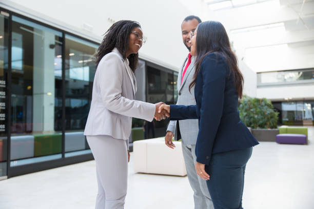 istock Cheerful friendly diverse business partners meeting each other 1174440244