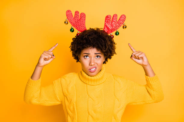 Am I Santa's Rudolf now. Photo of sad upset unsatisfied girl demonstrating big funky red bright with decor deer horns on her head in curly brown hairstyle isolated vibrant background Am I Santa's Rudolf now. Photo of sad upset unsatisfied girl demonstrating big funky, red bright with decor deer horns on her head in curly brown hairstyle isolated vibrant background ugly people crying stock pictures, royalty-free photos & images