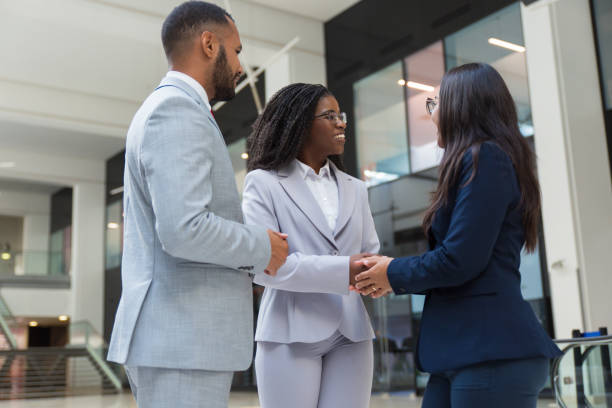 istock Friendly diverse businesswomen shaking hands with each other 1174440541