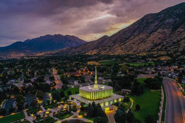 Provo Utah Latter-day Saint Temple The Provo Utah Temple, located near the campus of BYU, is seen here at dusk with the exterior lights on. provo stock pictures, royalty-free photos & images