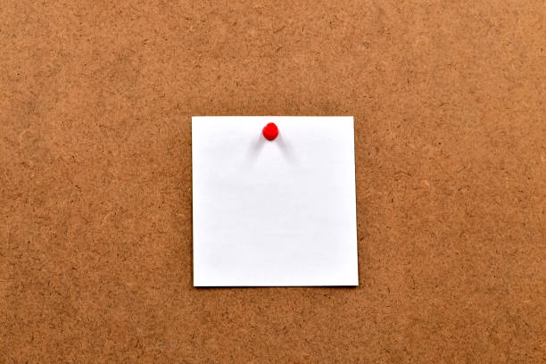 istock White blank sheet of paper attached to the chipboard with a push button 1174441613