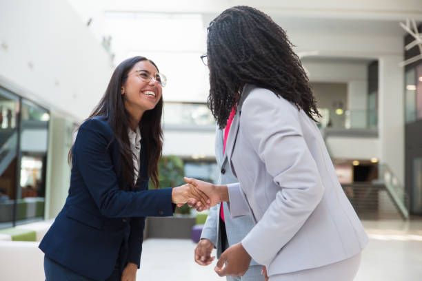 istock Happy excited diverse business partners greeting each other 1174441619
