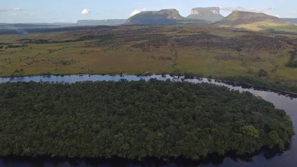 istock Small Tepuis (Flat Top Mountains) standing across a River in Canaima, Venezuela 1174442000