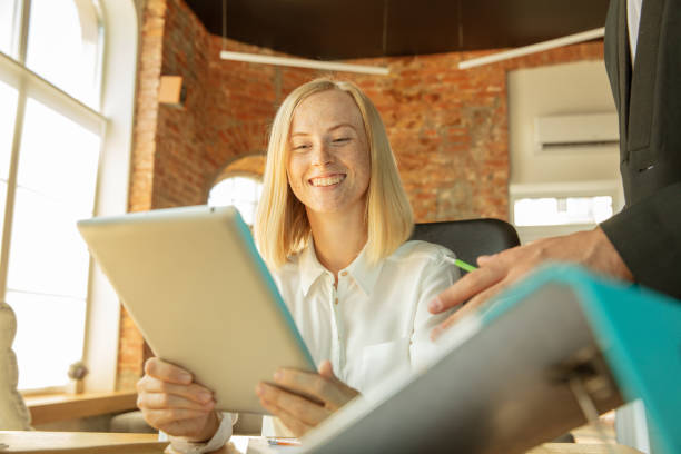 istock A young businesswoman moving in office, getting new work place 1174443368