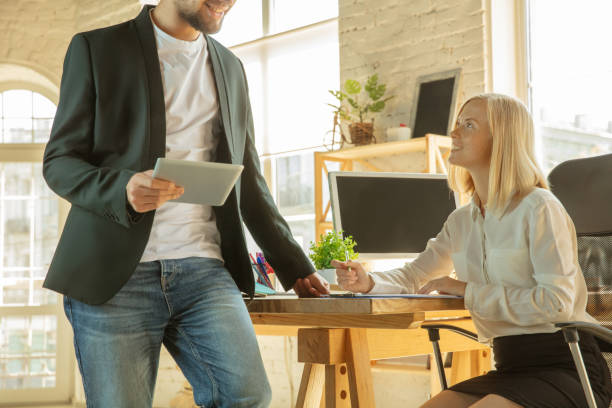 istock A young businesswoman moving in office, getting new work place 1174443386