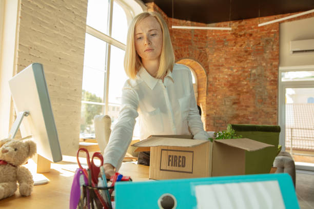 istock Young businesswoman fired, looks upset 1174443427