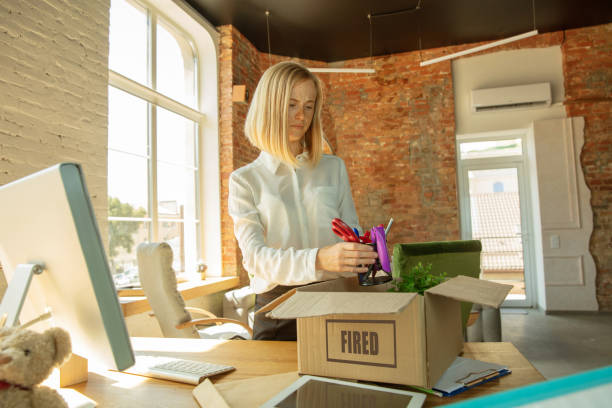 istock Young businesswoman fired, looks upset 1174443430