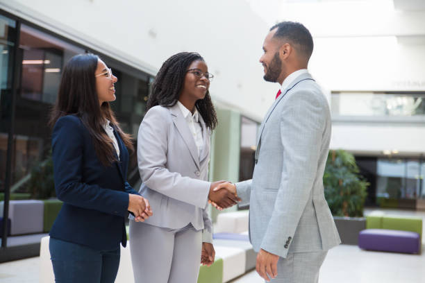 istock Happy joyful diverse business partners greeting each other 1174443443