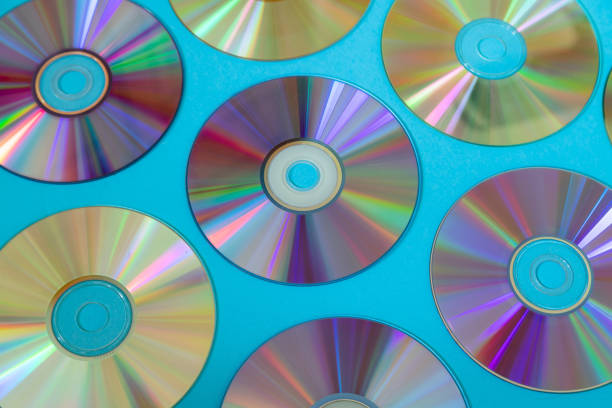 istock Vintage CD or DVD disk background, old circle discs used for data storage, share movies and music 1174443574