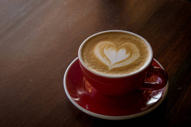 istock the red cup coffee love , coffee dark in wood dark table 1174448344