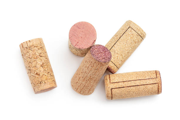 Bunch of wine corks Isolated on white background. Top view. Flat lay Bunch of wine corks Isolated on white background. Top view. Flat lay cork stopper stock pictures, royalty-free photos & images