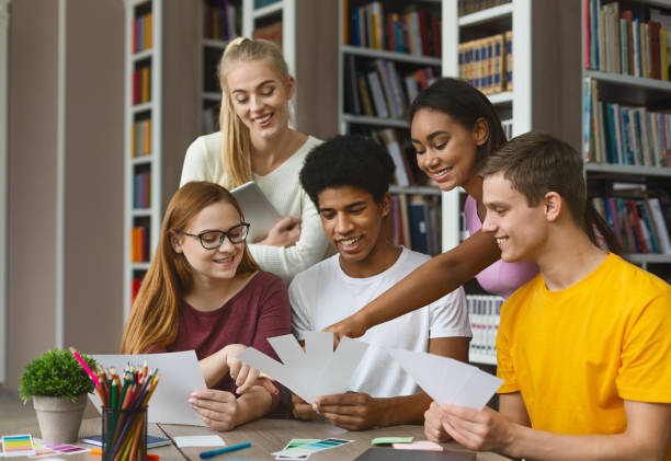 istock Young graphic designers choosing color texture for new project 1174449821