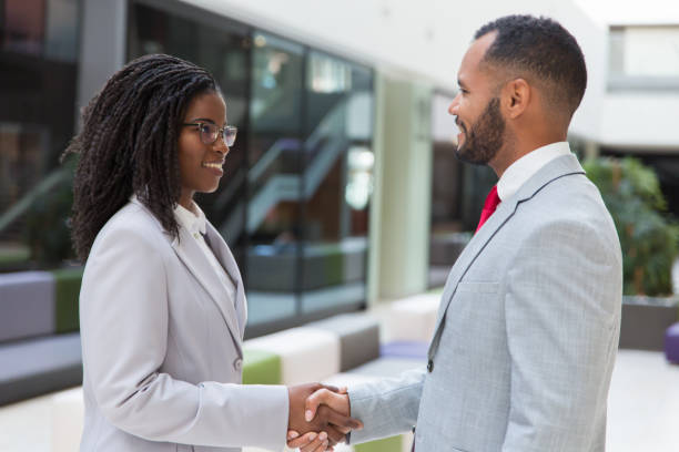 istock Happy successful business people greeting each other 1174449887