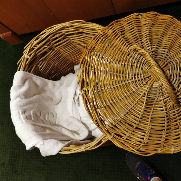 istock White shower towel place in laundry basket 1174449990