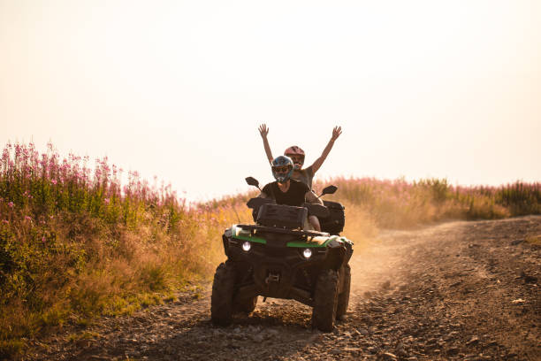 istock Couple exploring a mountain on a quad-bike 1174450438