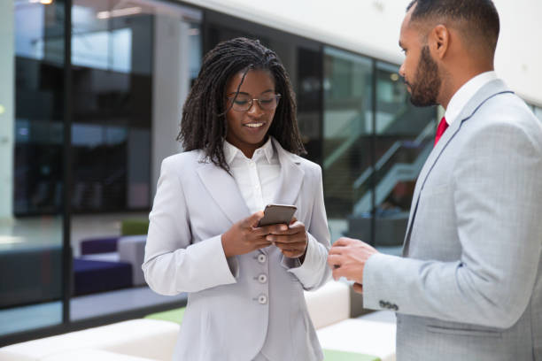 istock Positive business colleagues using mobile phones 1174452836