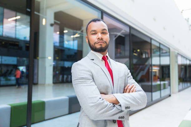 istock Confident young businessman looking at camera 1174456240