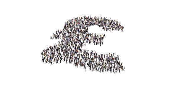istock Crowd of people forming a GBP symbol 1174461668