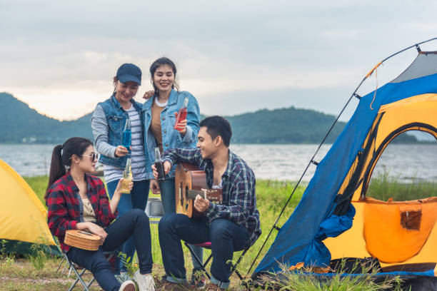 istock Group of backpackers relaxing near campfire, tourist background. 1174466724