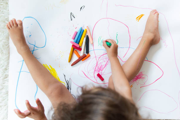 istock Little girl drawing 1174467392