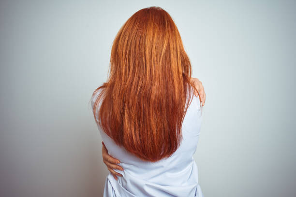 istock Young redhead doctor woman using stethoscope over white isolated background Hugging oneself happy and positive from backwards. Self love and self care 1174467418