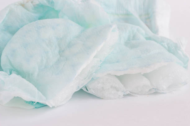 istock Baby diaper cut in half on white background, close-up 1174467623