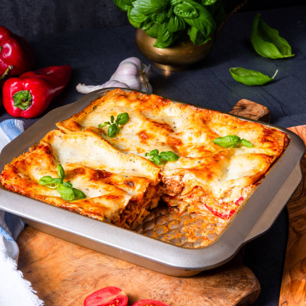 istock rustic spicy lasagne with basil on the tin. 1174467813
