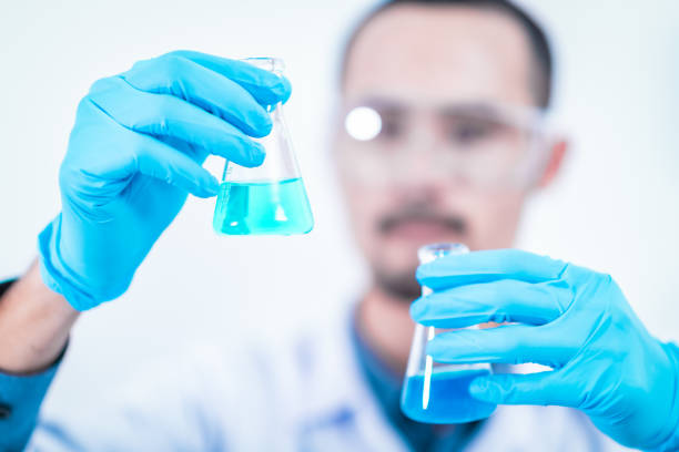 Asian scientist has researching in laboratory, chemical lab