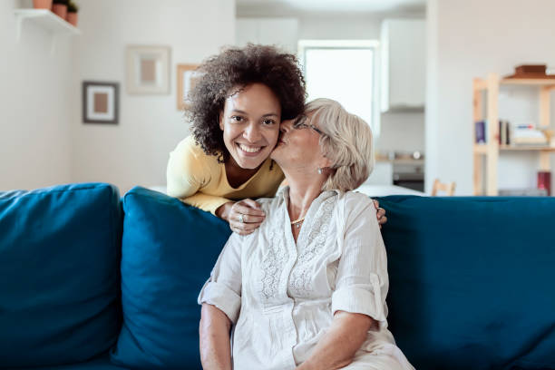 istock Mother Kissing Her Adopted Mixed Race Daughter 1174470496
