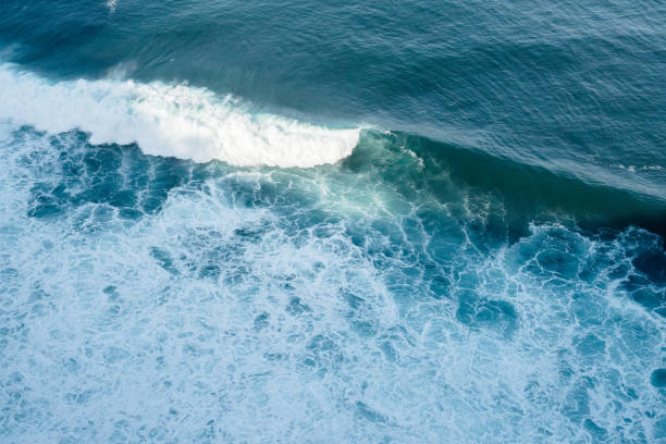 istock Breaking blue wave in bali, indonesia 1174470665