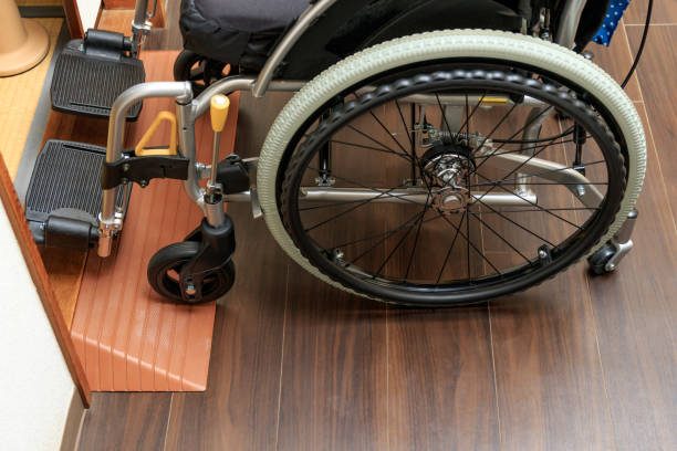 istock Wheelchair going up the slope 1174471360
