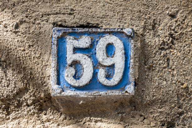 istock Street number sign on the wall 1174473462