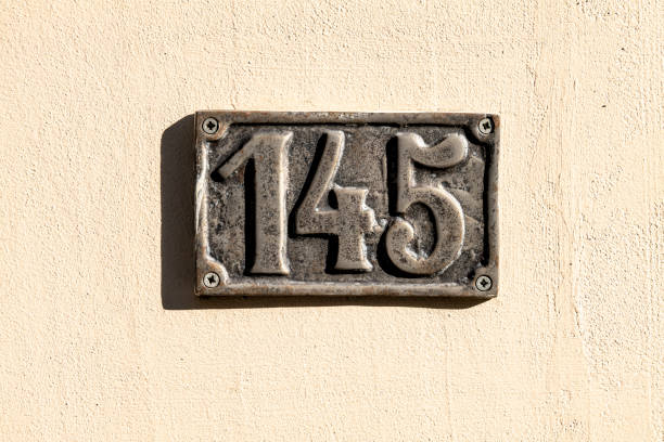 istock Street number sign on the wall 1174473541