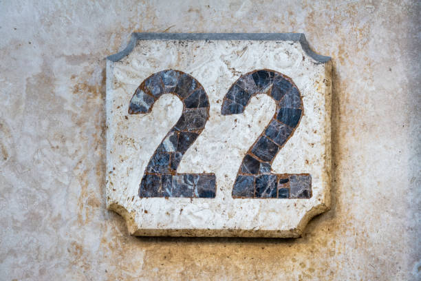 istock Street number sign on the wall 1174473892