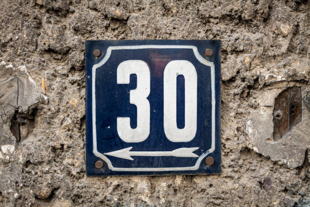 istock Street number sign on the wall 1174474872