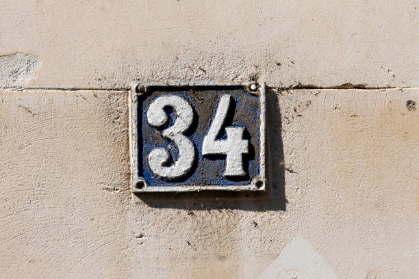 istock Street number sign on the wall 1174474988