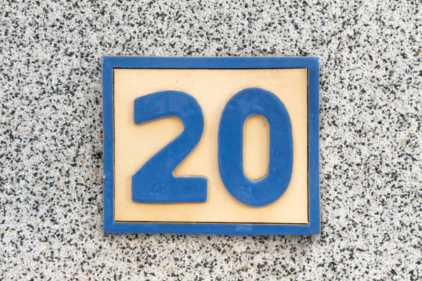Street number sign on the wall
