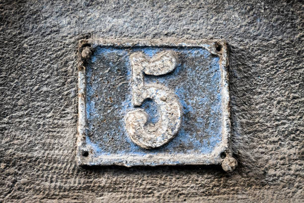 istock Street number sign on the wall 1174475499