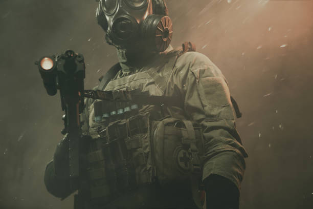 istock Special force soldier between smoke and dust at battlefield 1174475713