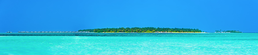 HiRes Panorama of tropical paradise beach at Sun Island resort, Nalaguraidhoo island, South Ari atoll, Maldives. Beautiful turquoise Indian ocean sea with white sand. Luxury travel holidays background. Property released. Photo stitched from several photos taken by Sony a7R II, 42 Mpix.
