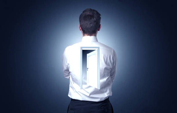 istock Businessman standing with door on his back 1174479216