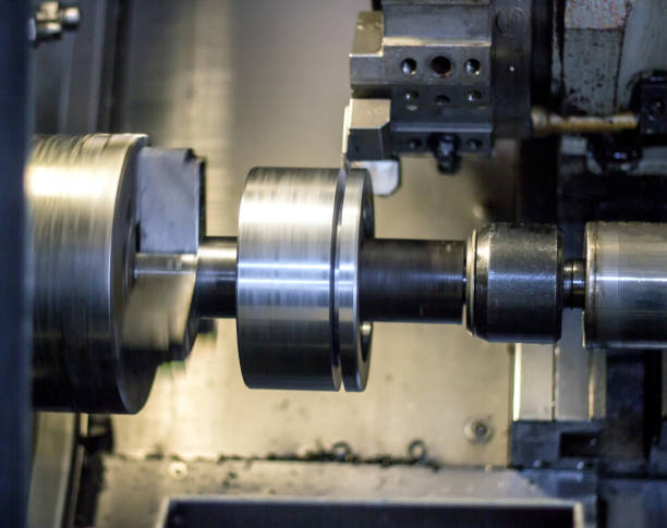 istock CNC lathe pulls out part of metal workpiece pulley, modern lathe for metal processing, close-up, machine cnc 1174479727